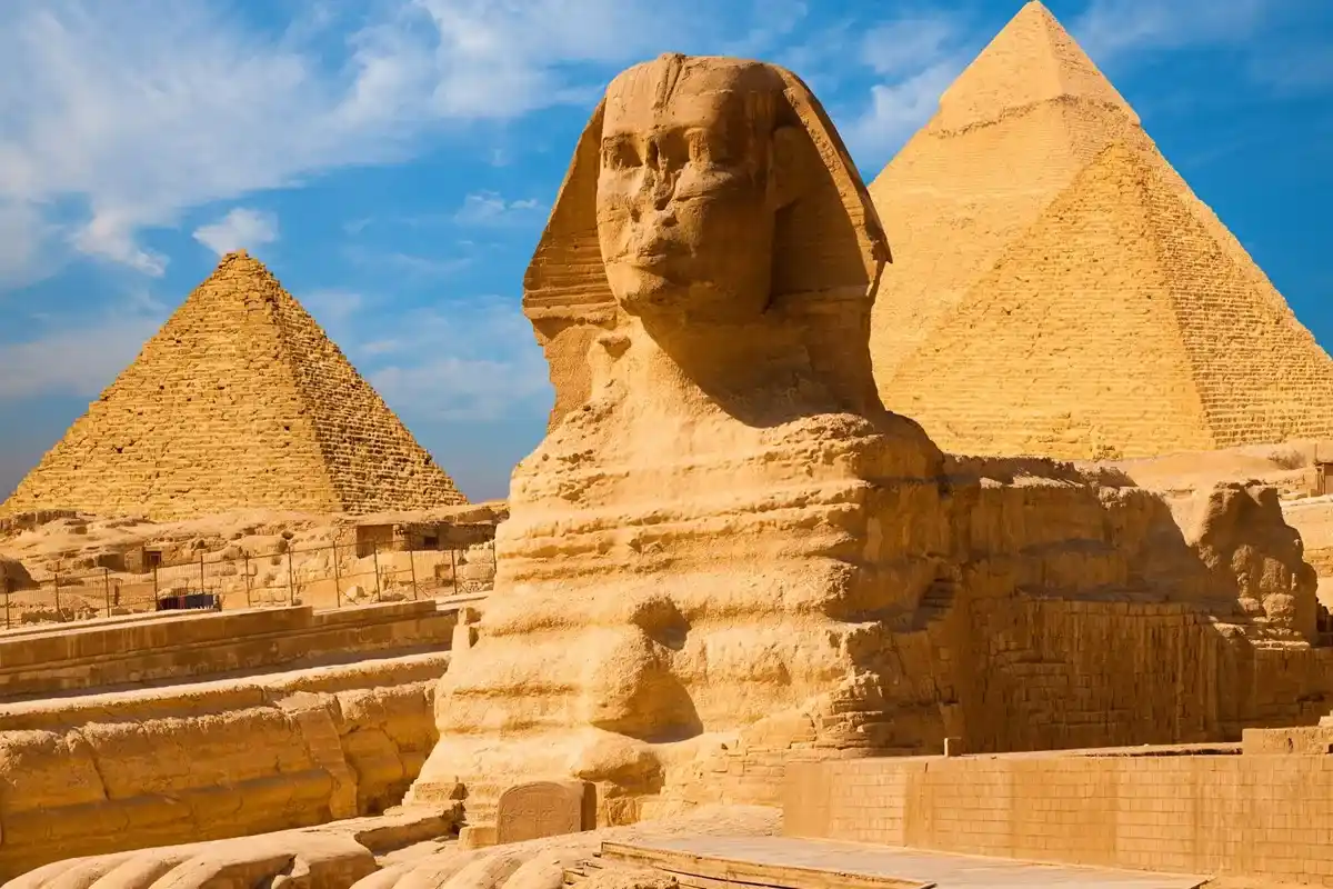 Camels resting in front of the Great Pyramids at Giza